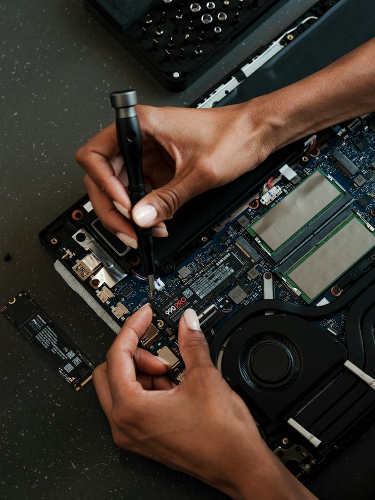a-person-working-on-a-laptop-with-a-pen-xts2fl2ixky